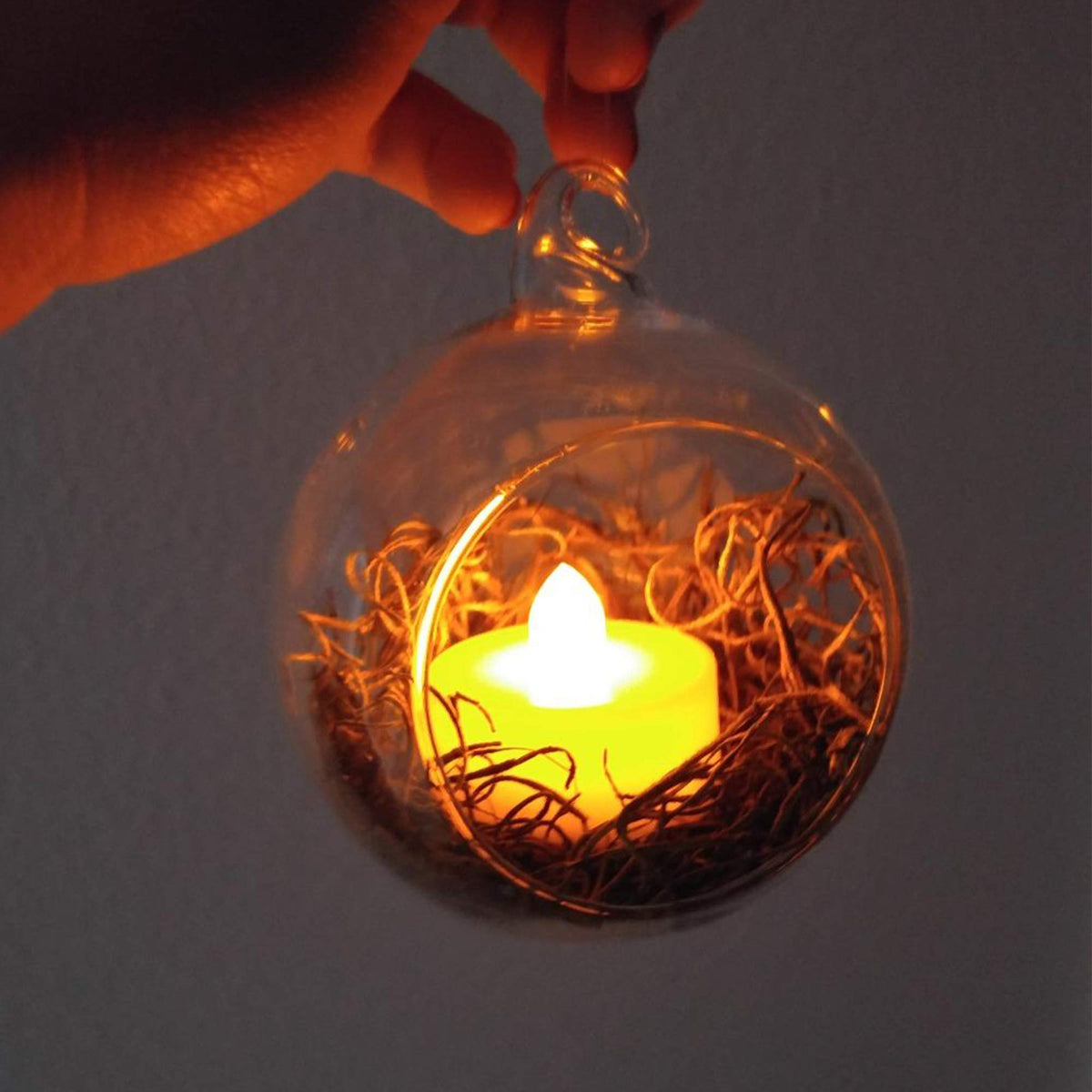 WGVI hanging terrarium globe doubles as a candle holder for ambience