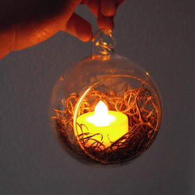 WGVI hanging terrarium globe doubles as a candle holder for ambience
