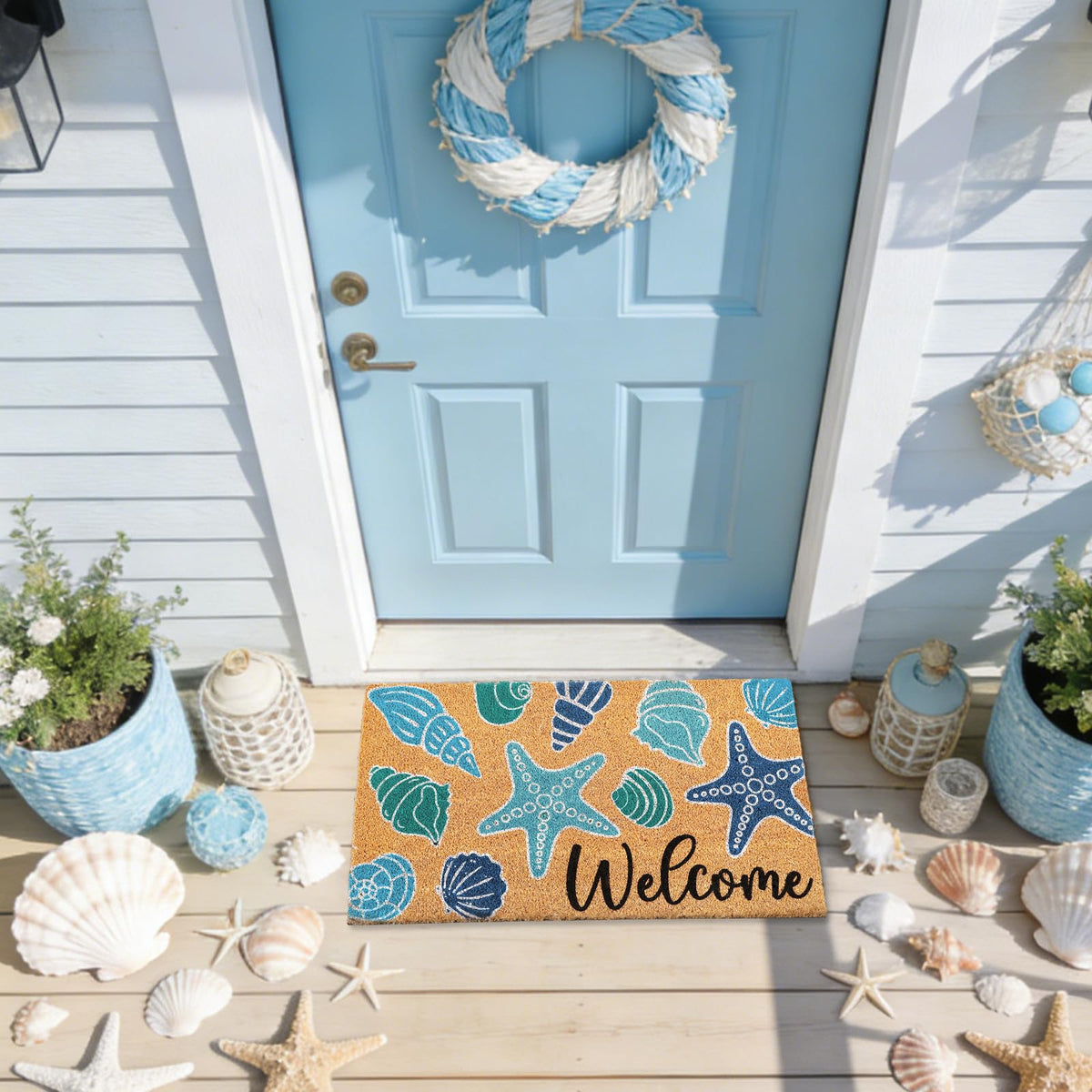Whaline seashell doormat black Welcome letters add a friendly greeting.