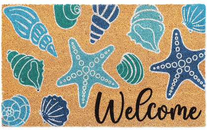 Whaline seashell doormat at the front door with blue coastal pattern for outdoor use.