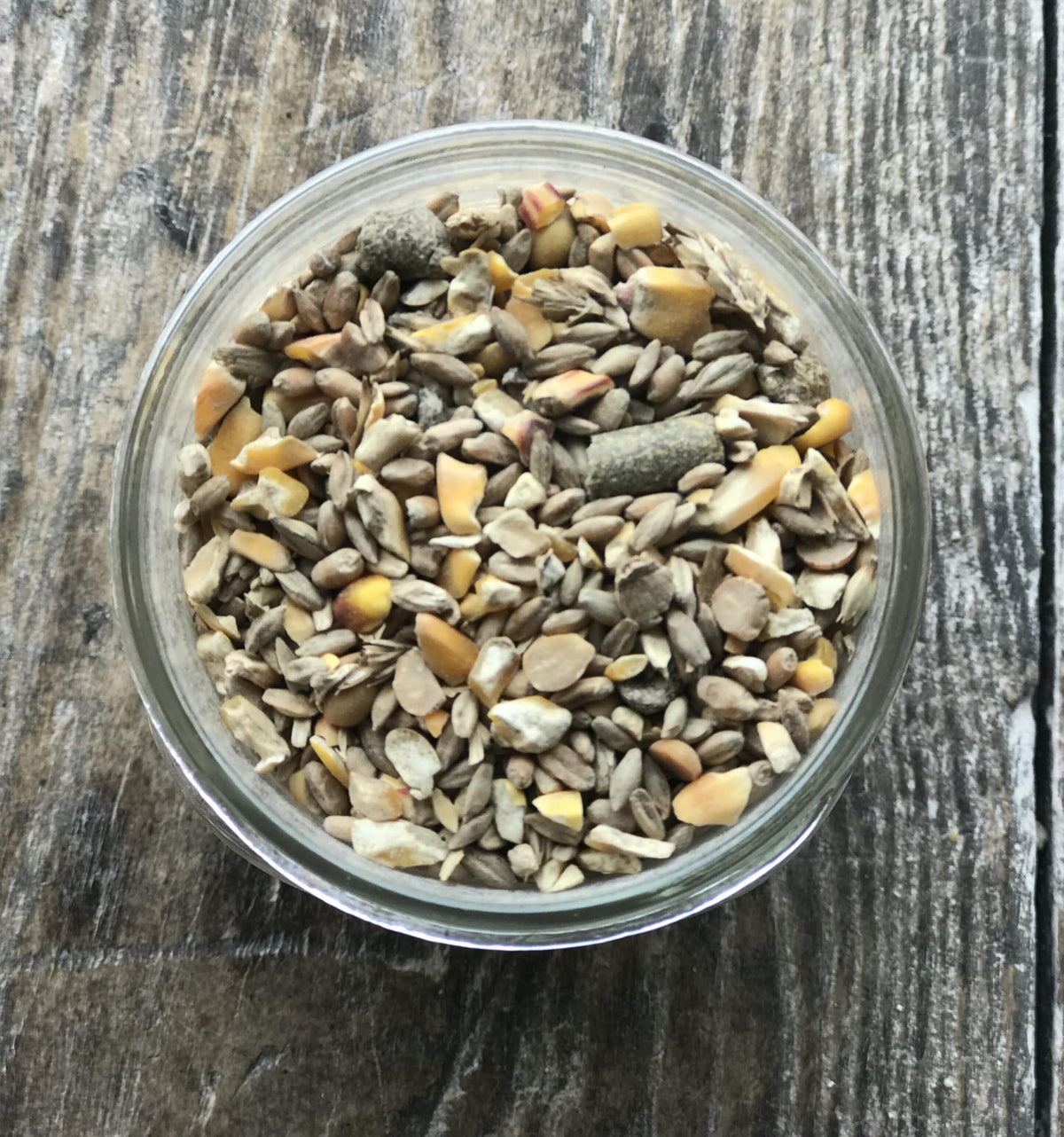 Wholesome Harvest pig feed pouring 10lb bag supports steady daily rations.