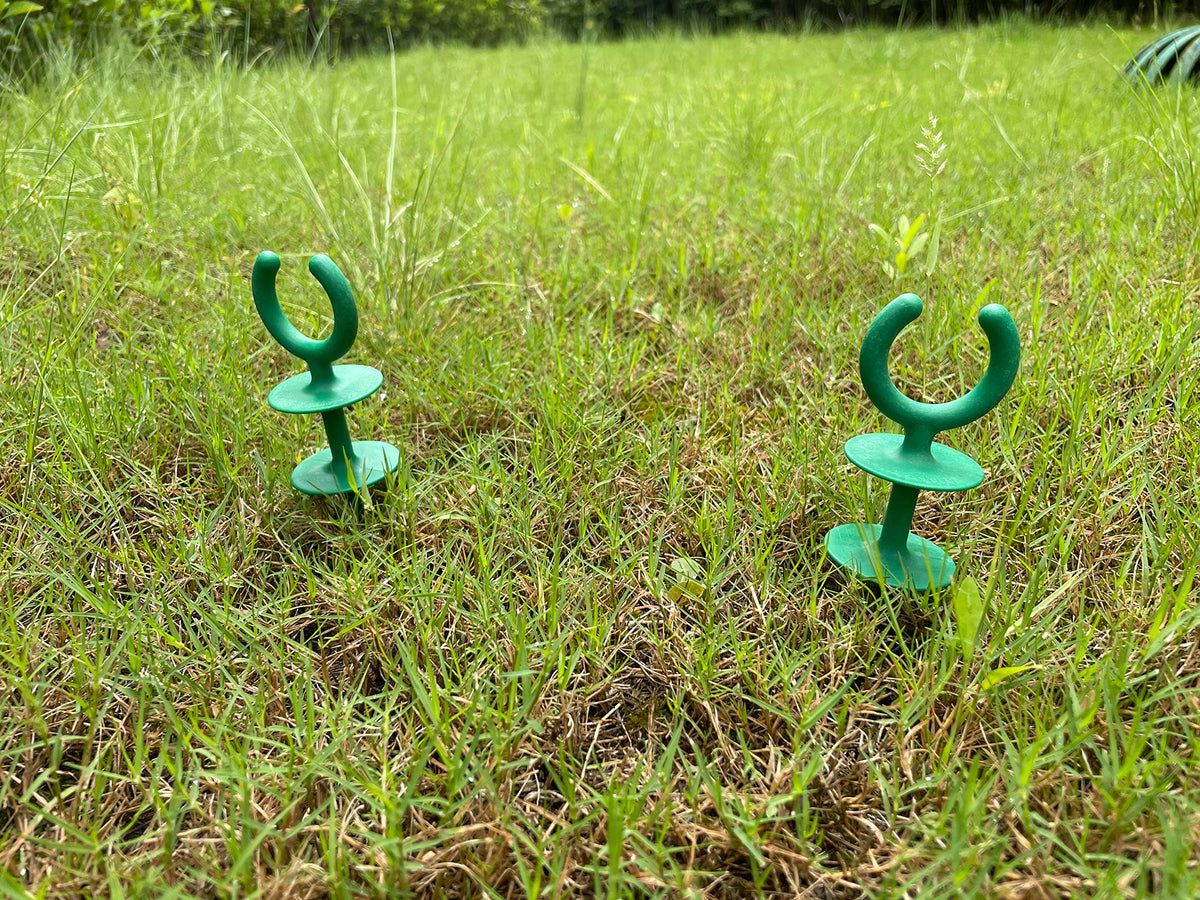 WIBBLESOX stake keeps hose off ground, protecting plants and beds