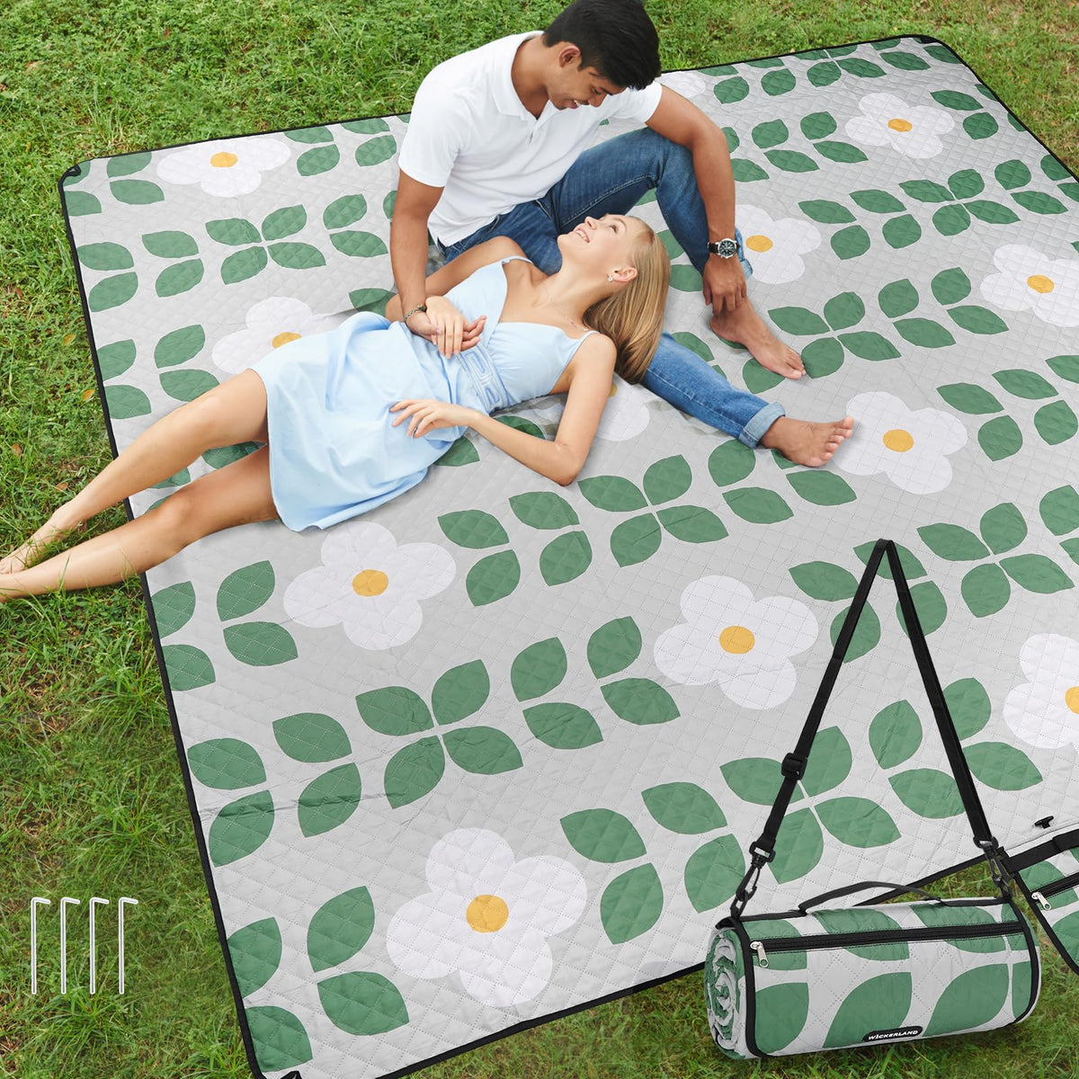 WICKERLAND picnic blanket three-layer design offers cushioned comfort on grass.