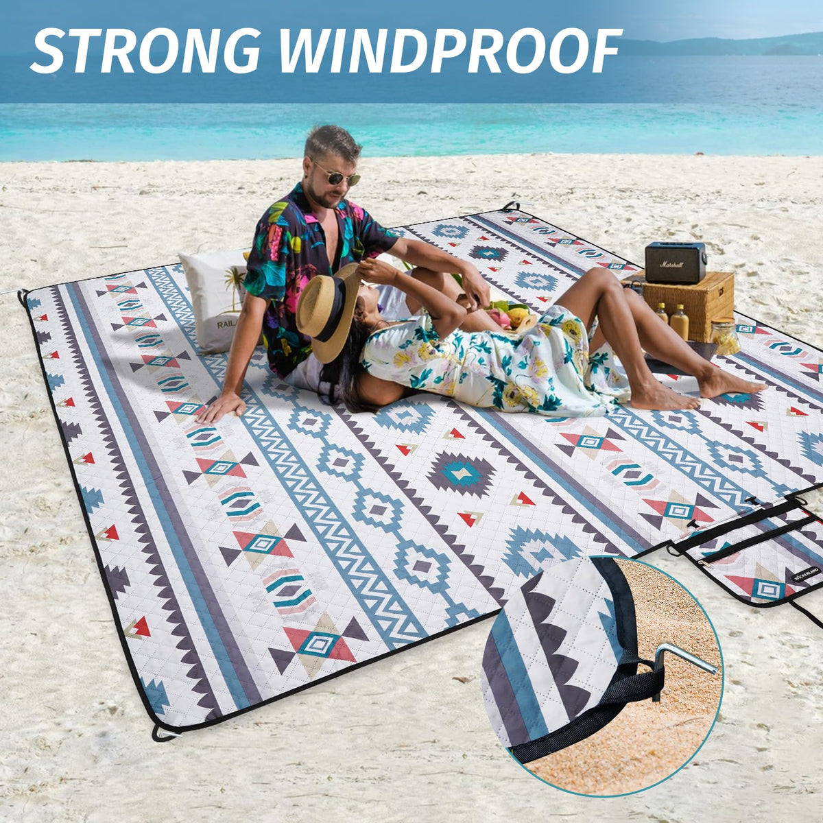 WICKERLAND picnic blanket rolls up compactly with a storage pocket.