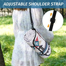 WICKERLAND picnic blanket with stakes provides windproof stability on sand or grass.