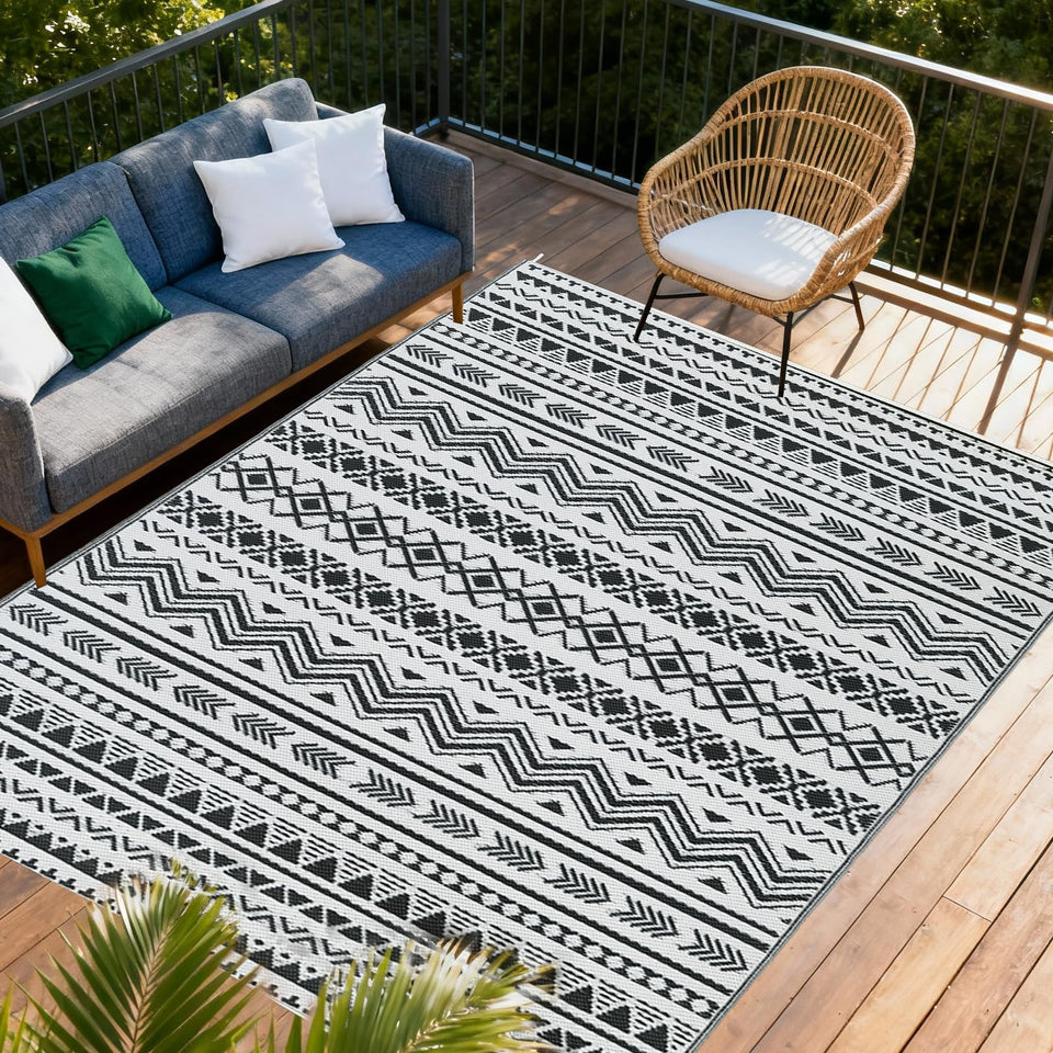 WildRoots 8x10 black and white outdoor rug folded for portability.