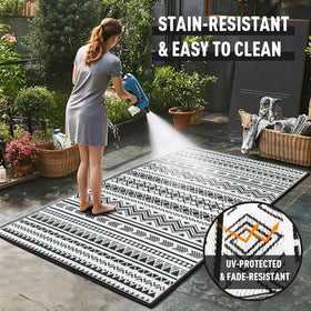 WildRoots rug with corner loops and stakes for secure anchoring.