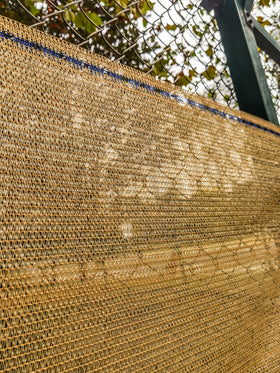 WindscreenSupplyCo shade cloth installation with blue-highlighted eyelets for quick setup