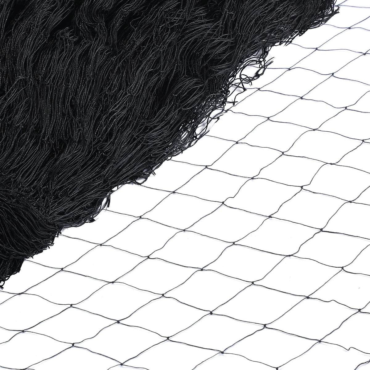 Windyun bird netting draped over a garden to deter birds while allowing sunlight.