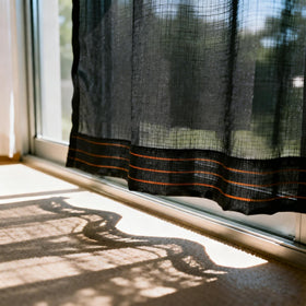 Winemana shade fabric drains water and cleans easily with a hose.