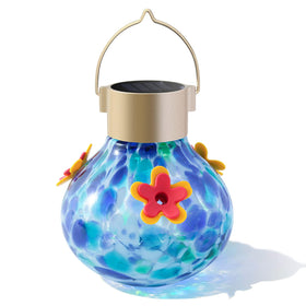 WLNYUGS solar glass hummingbird feeder in blue mixed colors attracts hummingbirds outdoors.