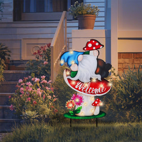 Wonder Garden outdoor sign mushroom lights up the yard at night.