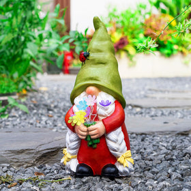 WONDHOME weatherproof resin gnome stands in sun and rain for year-round outdoor decor.