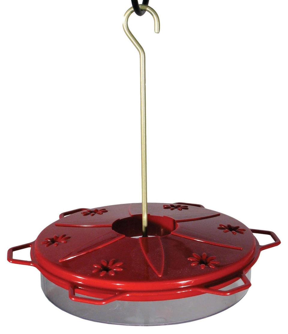Woodlink Audubon hummingbird feeder close-up of the colorful lid for attracting birds.