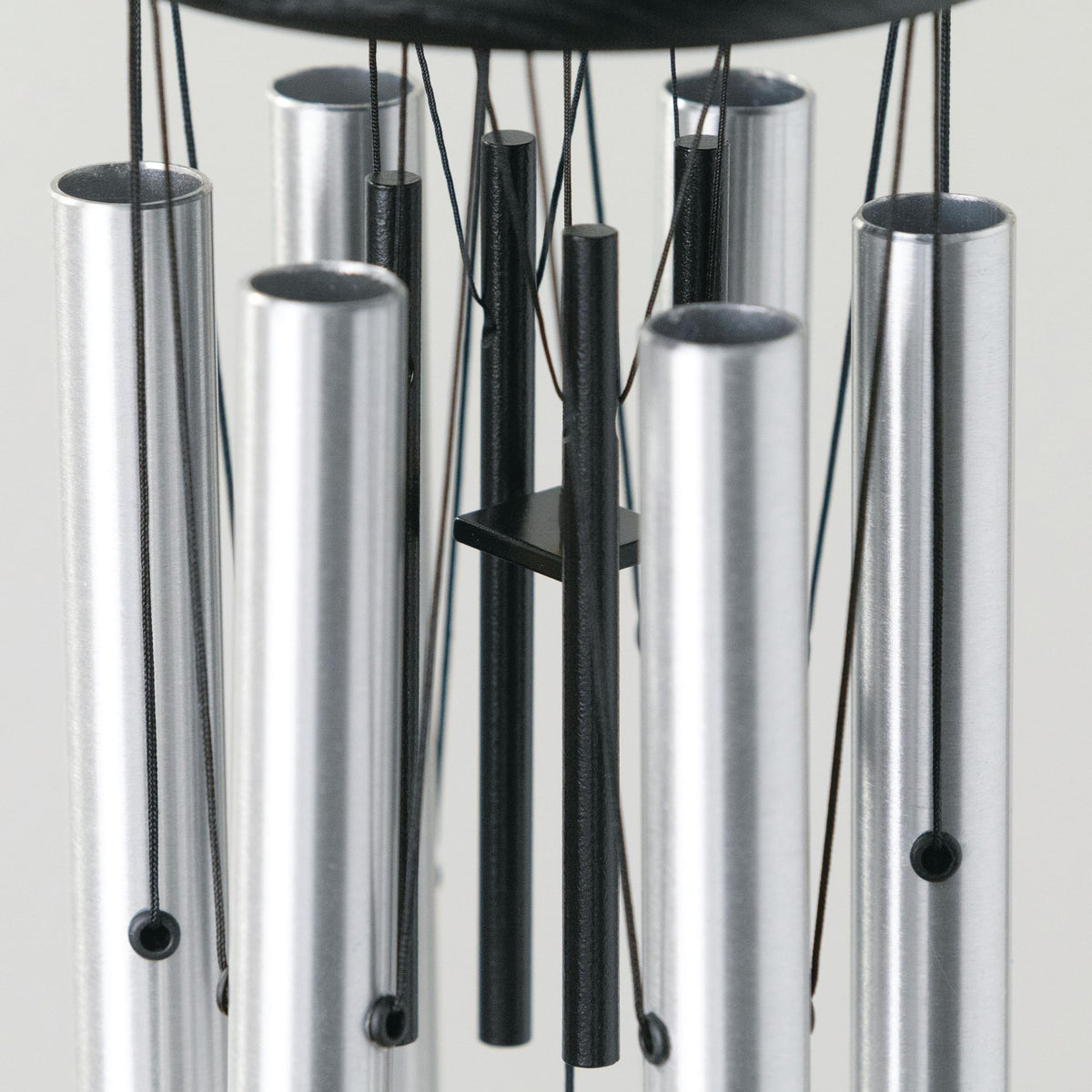 Four black aluminum rods provide stylish contrast and rust-free performance.
