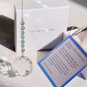 WOOWA Light by Your Side crystal suncatcher with sky-blue chain casting rainbow light