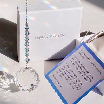 WOOWA Light by Your Side crystal suncatcher with sky-blue chain casting rainbow light