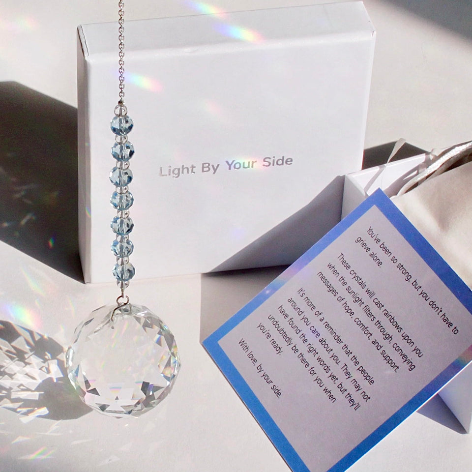 WOOWA Light by Your Side crystal suncatcher with sky-blue chain casting rainbow light