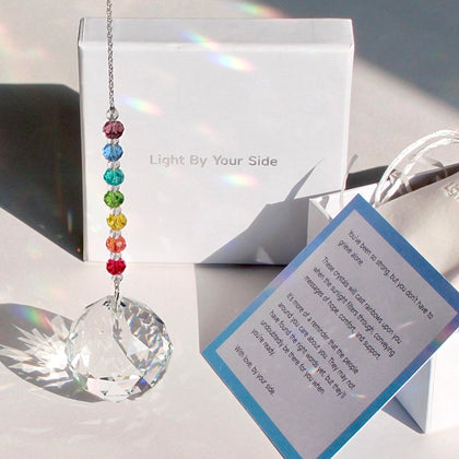 WOOWA Light by Your Side crystal suncatcher catching sunlight to cast rainbows at home