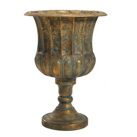 Worth Garden urn planter in bronze on a porch, showcasing classic outdoor charm.