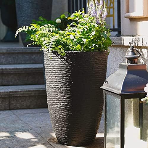Worth Garden imitation stone finish round planter in black for stylish spaces.
