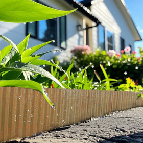 Worth edging used as stair riser border for neat garden accents