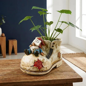 WPJFMXZ resin gnome shoe planter close-up showing details and finish.