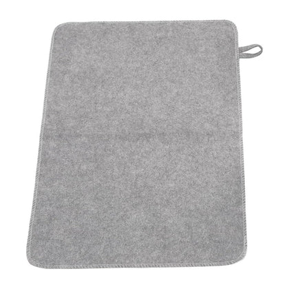WQAPVHBG felt sauna cushion on bench for compact seating.