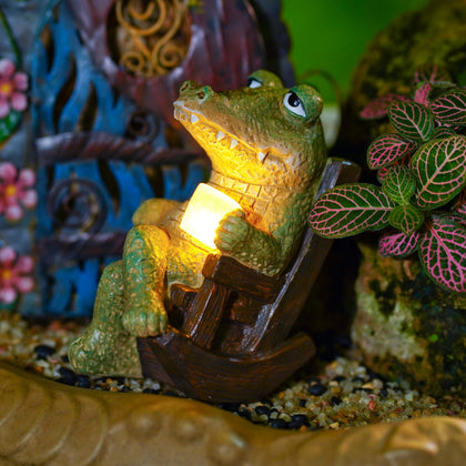 WSHMZYHOME solar crocodile garden statue glows softly for outdoor ambiance.