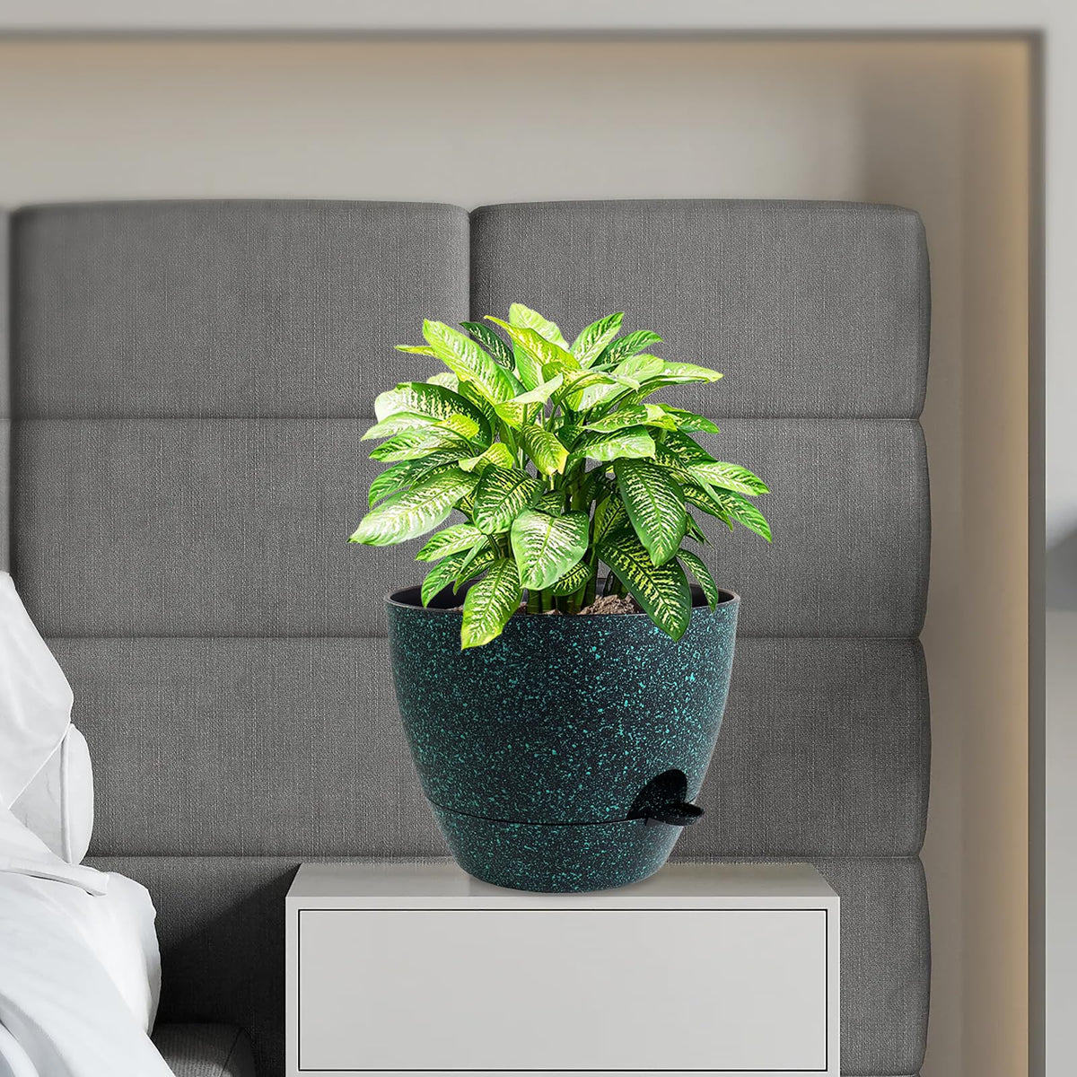 Black with green speckles finish enhances modern plant displays.