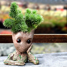 WT WINGTENG Baby Groot pot used as pen holder keeps clutter tidy.