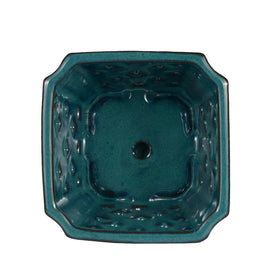 W&W orchid pot with saucer keeps surfaces clean during care.