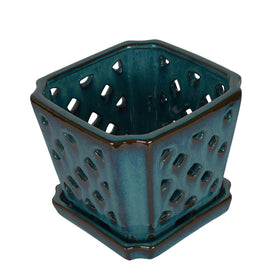W&W glazed teal orchid pot adds an elegant decor touch.