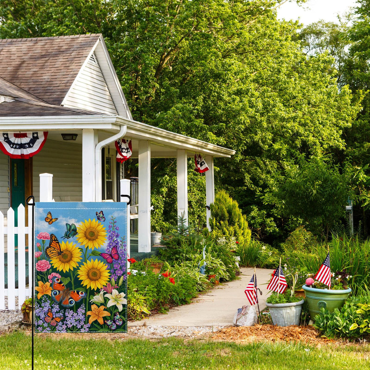 Wyooxoo double-sided floral garden flag visible from both sides in garden setting