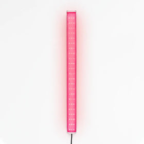 X-Vitalis red light panel on bench in portable sauna for a soothing session.