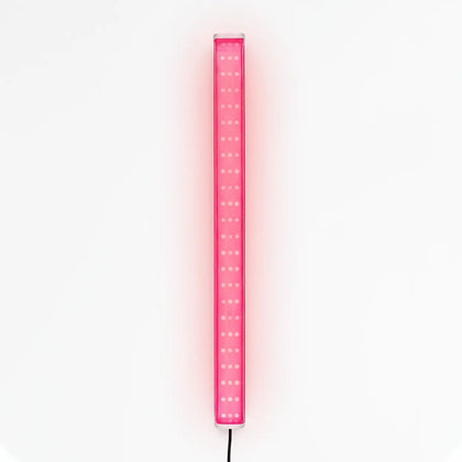 X-Vitalis red light panel on bench in portable sauna for a soothing session.