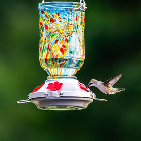 XAROO outdoor decor hummingbird feeder blends into garden setting.