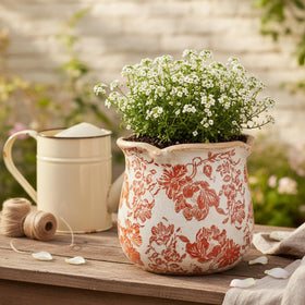 Xiaan Jiaju vintage distressed ceramic pot detail highlights rustic charm for cozy rooms.