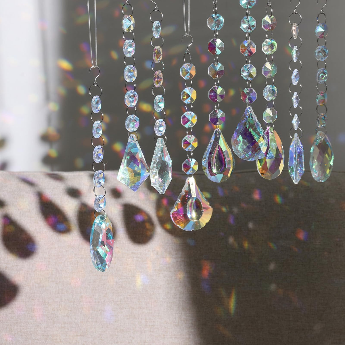 XINRUI Sun Catcher window hanging casts shimmering reflections across a room.