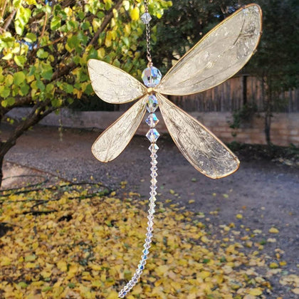 XinTX Dragonfly crystal suncatcher in rainbow glow brightens windows with shifting light