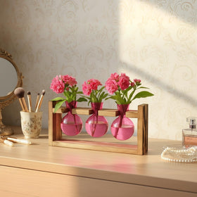 XXXFLOWER pink glass vase with bulbs for easy propagation and display.