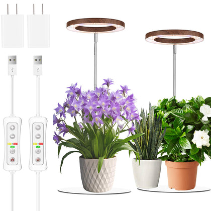 Yadoker 144-LED grow light with walnut housing shines on indoor herbs.