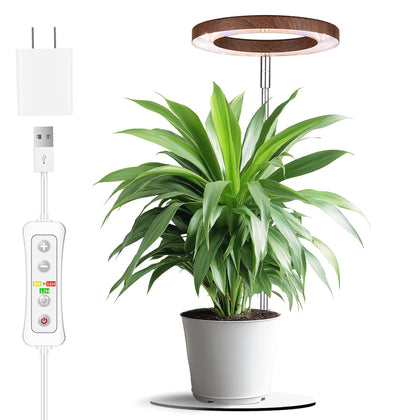 Yadoker 72-LED grow light panel on a desk brightening indoor herbs