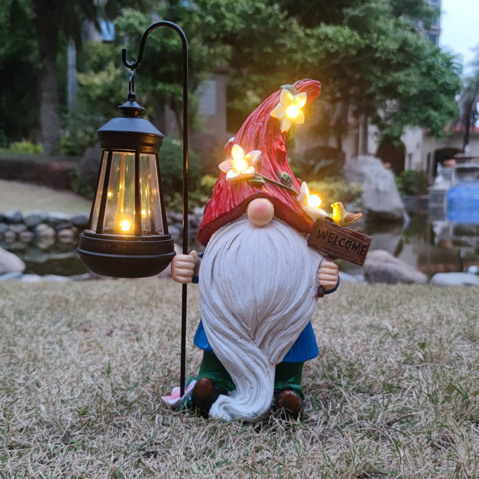 Yardancer solar gnome garden-lantern lights the yard at dusk