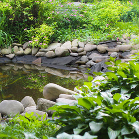 Yarlung backyard waterfall liner helps create a tidy edge and flow.