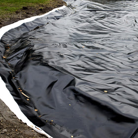 Yarlung pond liner underlayment providing a flat base for water features