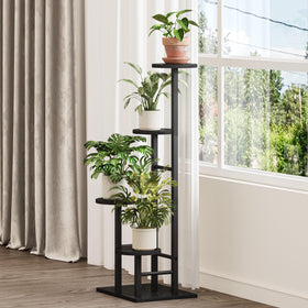 YAUKTAK display stand with shelves, versatile for books or candles.