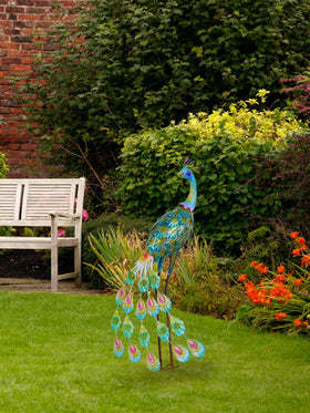 Bright blue-green hues shimmer in sun, creating focal interest on your patio.