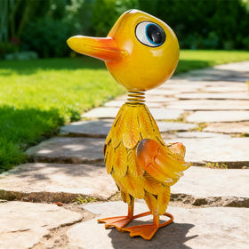 Spring-loaded neck duck statue sways with wind for subtle yard motion.