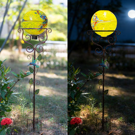 Ground-spike stand from YELENEW securing a decorative ball on the lawn.